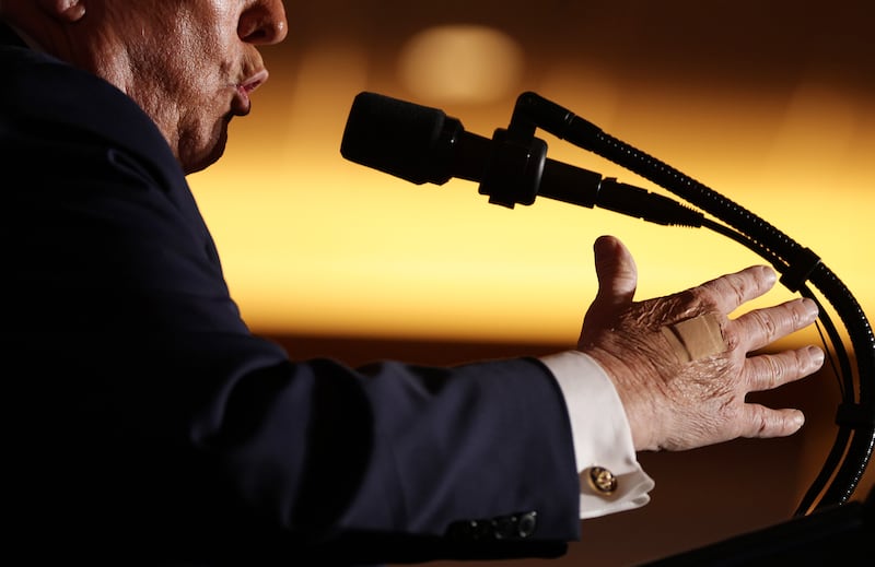 A bandage is visible on U.S. President Donald Trump's right hand as he delivers remarks during an event at Mount Airy Casino Resort on December 9, 2025 in Mount Pocono, Pennsylvania.
