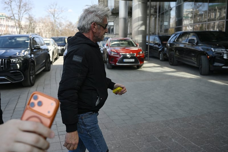 US actor Sean Penn walks down a street in Kyiv on March 16, 2026, amid the Russian invasion of Ukraine. Sean Penn, who scored an Oscar for best supporting actor for "One Battle After Another" on March 15, 2026, is in Ukraine to show support to the war-torn country, a senior Ukrainian official told AFP. Penn -- a vocal advocate for Ukraine who had visited the country several times -- has won his third acting Oscar but was not at the ceremony. (Photo by Genya SAVILOV / AFP via Getty Images)