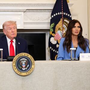 President Donald Trump with then Homeland Security Secretary Kristi Noem speak during a roundtable on October 8, 2025.