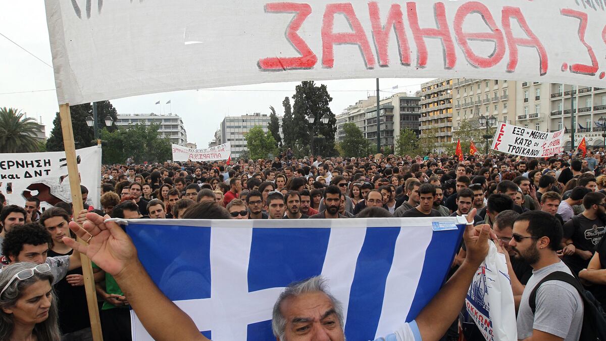 articles/2012/10/09/angela-merkel-in-greece-long-path-to-recovery/nadeau-merkel-greece-visit-tease_glyuns