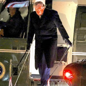 President Donald Trump walks off Marine One on the South Lawn of the White House on January 22, 2026 in Washington, DC. Trump attended the World Economic Forum (WEF) in Davos, Switzerland.