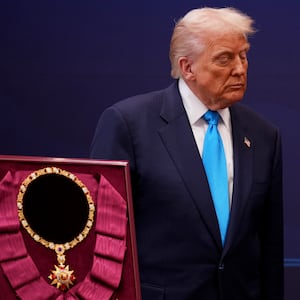 GYEONGJU, SOUTH KOREA - OCTOBER 29: U.S. President Donald Trump reacts as he is presented with the Grand Order of Mugunghwa and the Silla gold crown by South Korean President Lee Jae Myung at the Gyeongju National Museum on October 29, 2025 in Gyeongju, South Korea. Trump is in South Korea for the APEC meetings, following an appearance at the ASEAN summit in Malaysia, and a trip to Japan, where he called on Japanese Emperor Naruhito and new Prime Minister Sanae Takaichi. (Photo by Andrew Harnik/Getty Images)