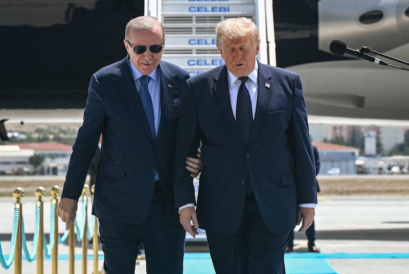 Turkish President Recep Tayyip Erdogan welcomes US President Donald Trump upon his arrival on Air Force One at Etimesgut Air Base near Ankara, on July 7, 2026, before attending the 36th NATO Heads of State and Government Summit.