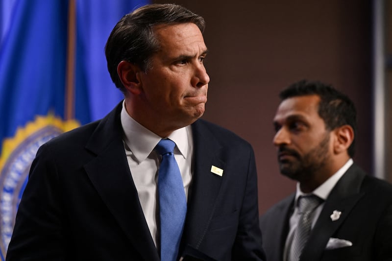 Acting U.S. Attorney General Todd Blanche looks on as Federal Bureau of Investigation (FBI) Director Kash Patel stands by his side during a press conference at the Department of Justice in Washington, D.C., U.S., April 21, 2026.