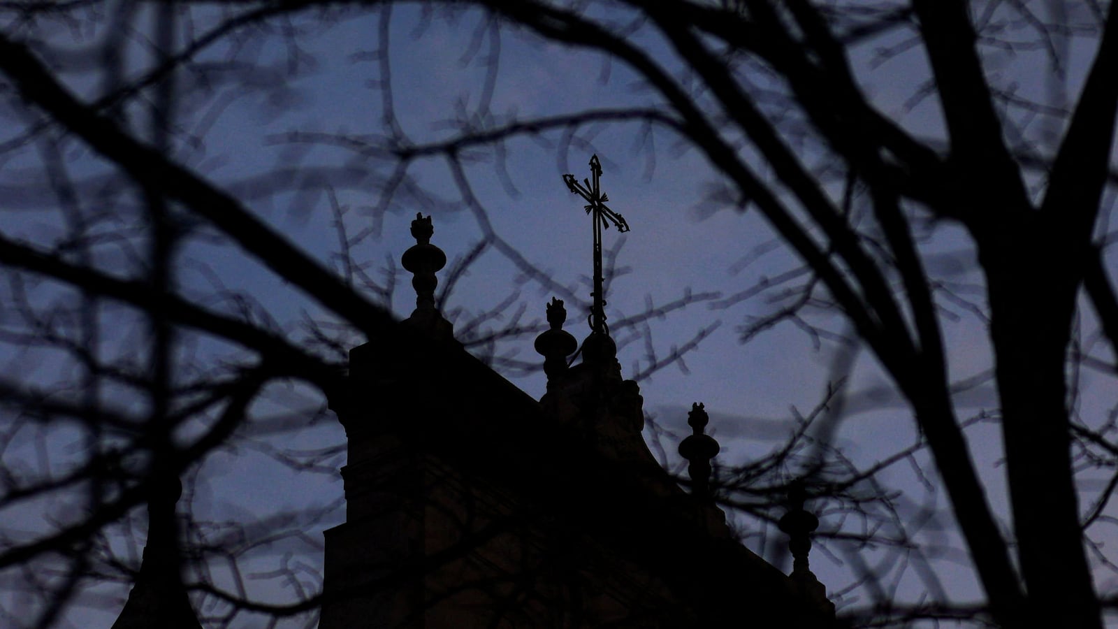 A cross at the top of a church.