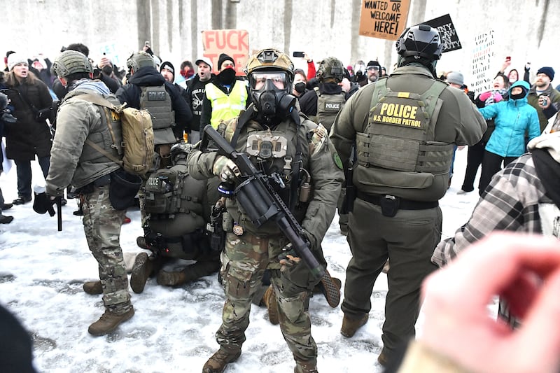 Protestors clash with federal agents outside the Bishop Henry Whipple Federal Building in Saint Paul, Minnesota