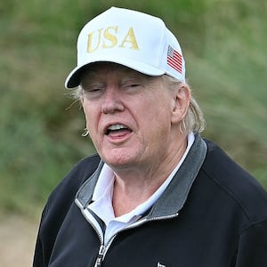 President Donald Trump reacts after playing from the first tee to officially open the Trump International Golf Links course in Balmedie, Aberdeenshire, north east Scotland on July 29, 2025.
