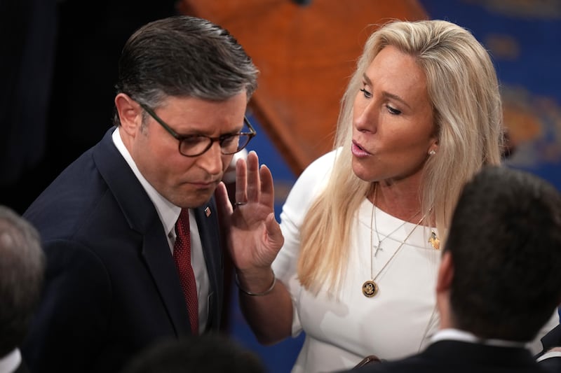 WASHINGTON, DC - JANUARY 03: U.S. Speaker of the House Mike Johnson (R-LA) (L) talks to Rep. Marjorie Tayler Greene (R-GA) as they arrive for the first day of the 119th Congress in the House Chamber of the U.S. Capitol Building on January 03, 2025 in Washington, DC. Rep. Johnson is working to retain the Speakership in the face of opposition within his own party as the 119th Congress holds its first session to vote for a new Speaker of the House. (Photo by Andrew Harnik/Getty Images)