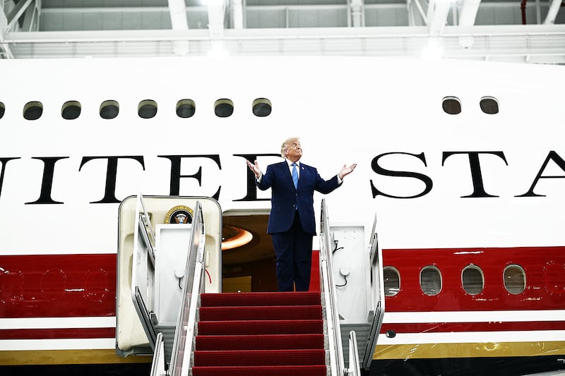US President Donald Trump steps out of the new Air Force One,