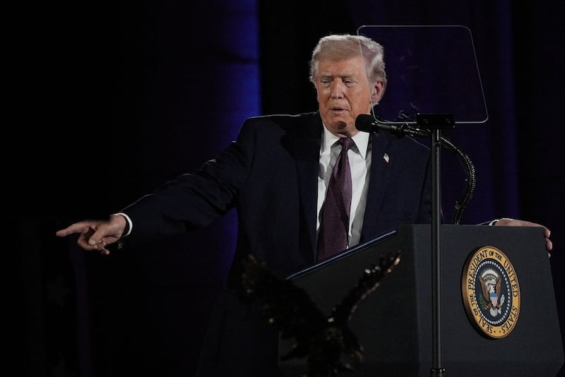 President Donald Trump points as he delivers a speech during the National Republican Congressional Committee (NRCC) annual fundraising dinner in Washington, D.C., U.S., March 25, 2026.