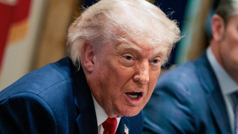 U.S. President Donald Trump speaks next to Defense Secretary Pete Hegseth during a cabinet meeting in the Cabinet Room at the White House, in Washington, D.C.