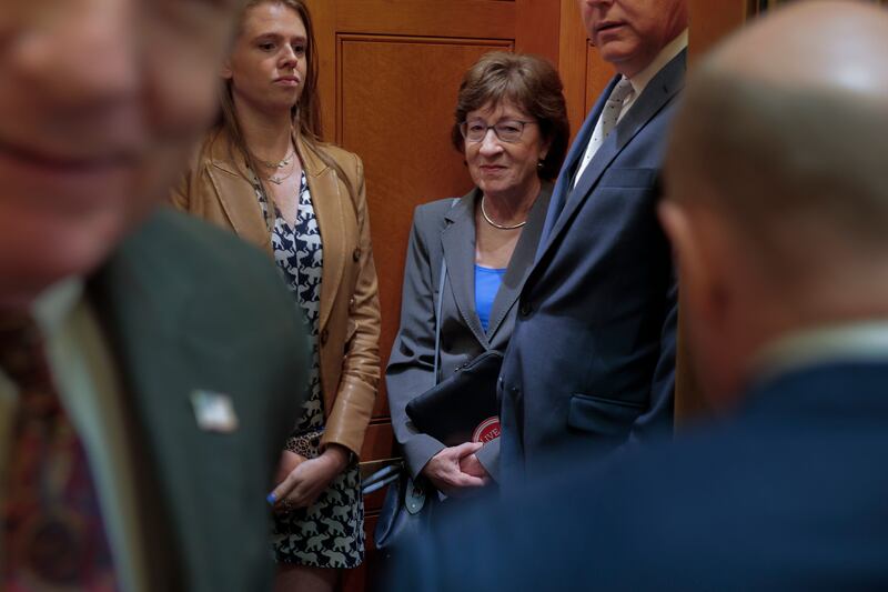 Sen. Susan Collins (center right) boards a elevator at the U.S. Capitol in between votes on July 31, 2025 in Washington, D.C.