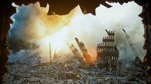 The rubble of the World Trade Center smolders following a terrorist attack September 11, 2001 in New York.