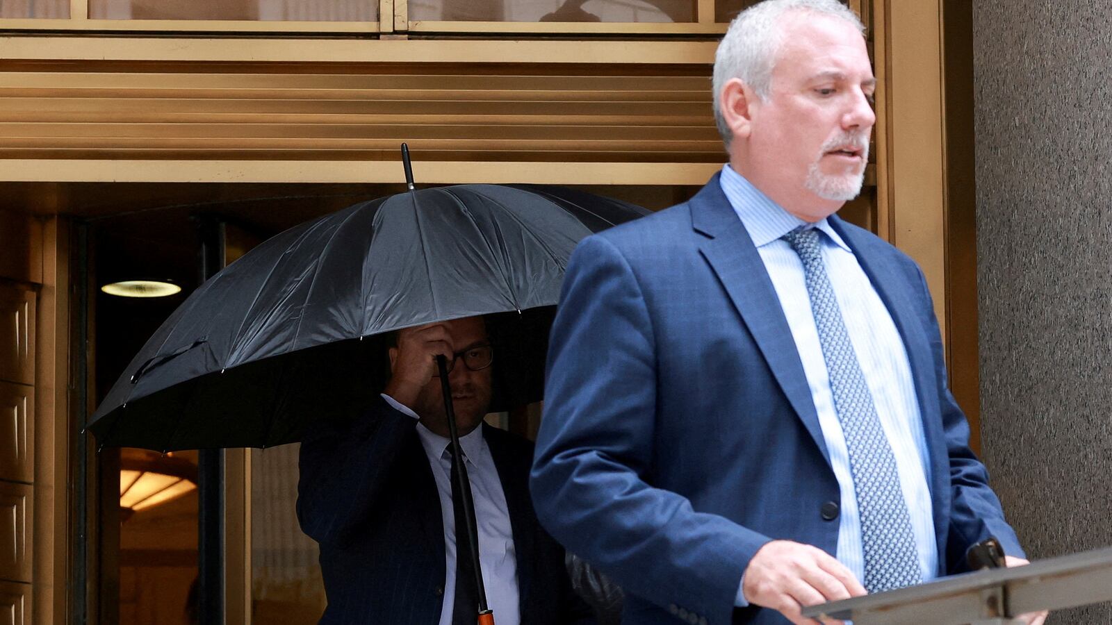 Michael Shvartsman walks out of a New York City courthouse.