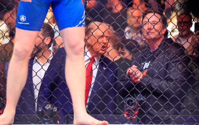 US President-elect Donald Trump (L) and Tesla and SpaceX CEO Elon Musk watch a fight during UFC 309 at Madison Square Garden in New York, on November 16, 2024. US President-elect Donald Trump was greeted by chanting fans as he attended the Ultimate Fighting Championship heavyweight bout at New York's Madison Square Garden on November 16.
Trump entered the arena shortly before the start of the main card accompanied by UFC chief executive Dana White, who was a prominent backer during his election campaign.
Several political allies of Trump were also in attendance including entrepreneurs Elon Musk and Vivek Ramaswamy, who have been asked by Trump to lead efforts to cut government inefficiency.