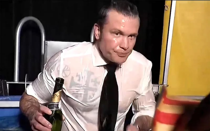 Pete Hegseth drinks champagne in a dunk tank during a Fox News 2023 New Year's segment.