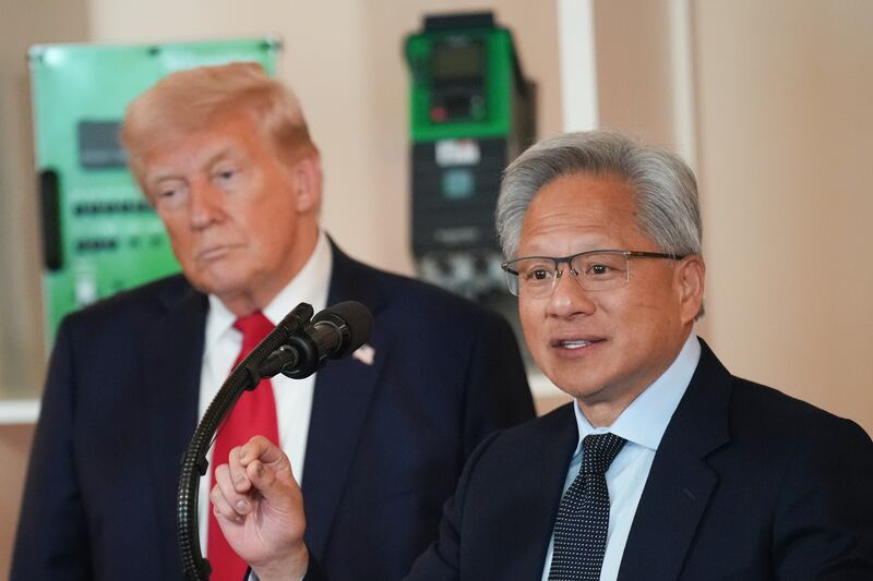 WASHINGTON, DC - APRIL 30: U.S. President Donald Trump (L) listens as Nvidia CEO Jensen Huang speaks in the Cross Hall of the White House during an event on "Investing in America" on April 30, 2025 in Washington, DC. Trump was joined by CEOs to highlight companies and their investments in the United States during the event. (Photo by Andrew Harnik/Getty Images)