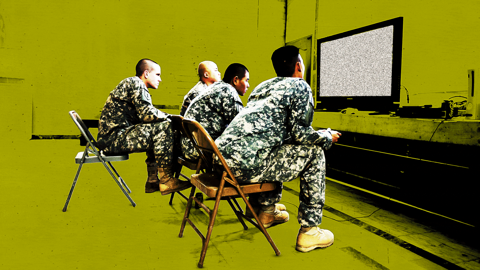 Soldiers playing a video game.