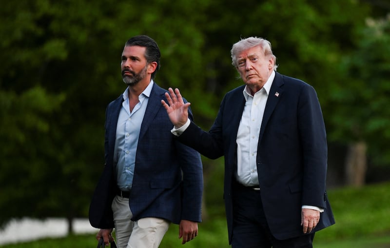 U.S. President Donald Trump and his son Donald Trump Jr. arrive at the White House in Washington, D.C., U.S., May 3, 2026.