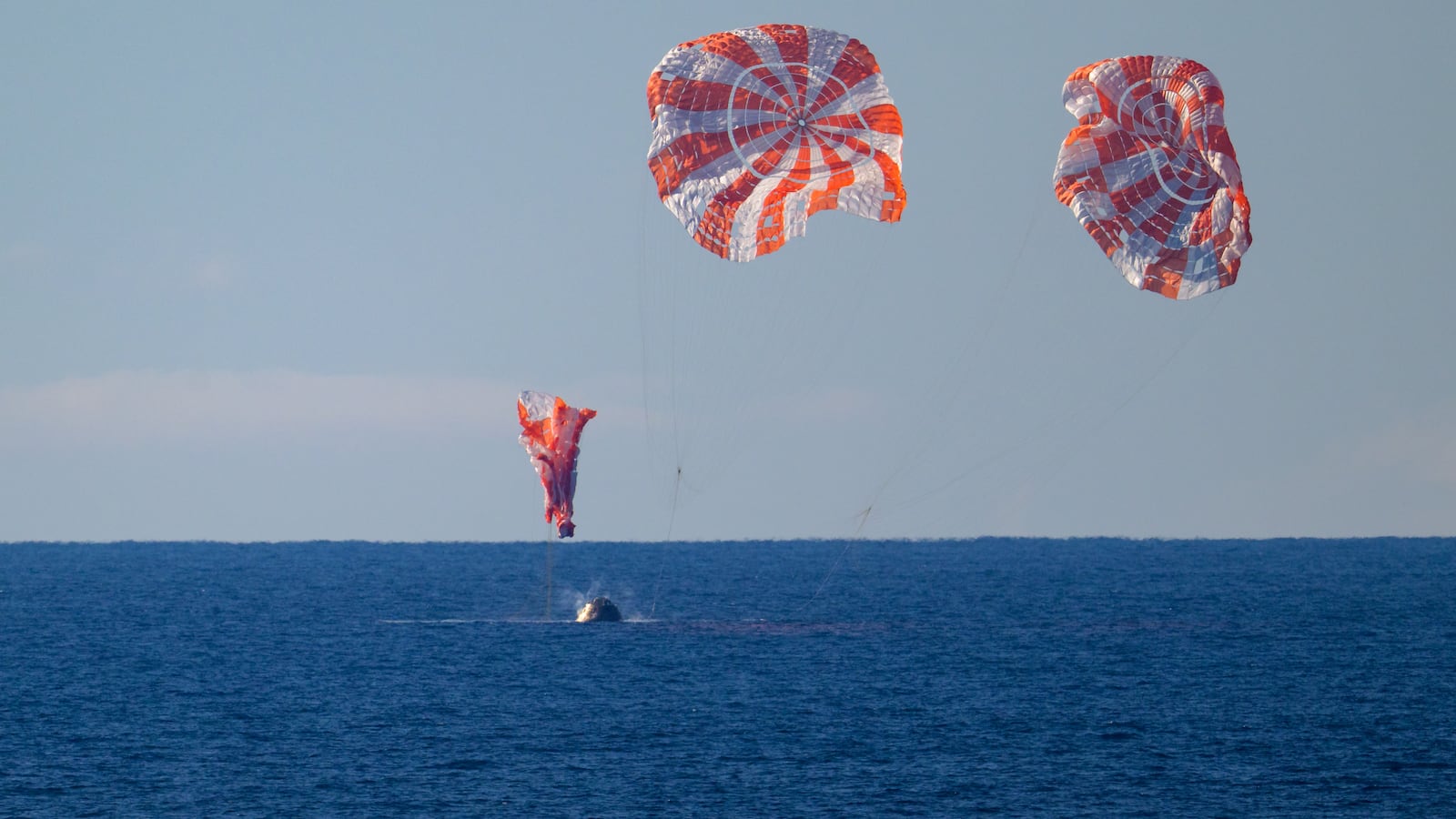 NASA's Orion spacecraft with Artemis II crewmembers seen as it lands in the Pacific Ocean off the coast of California.