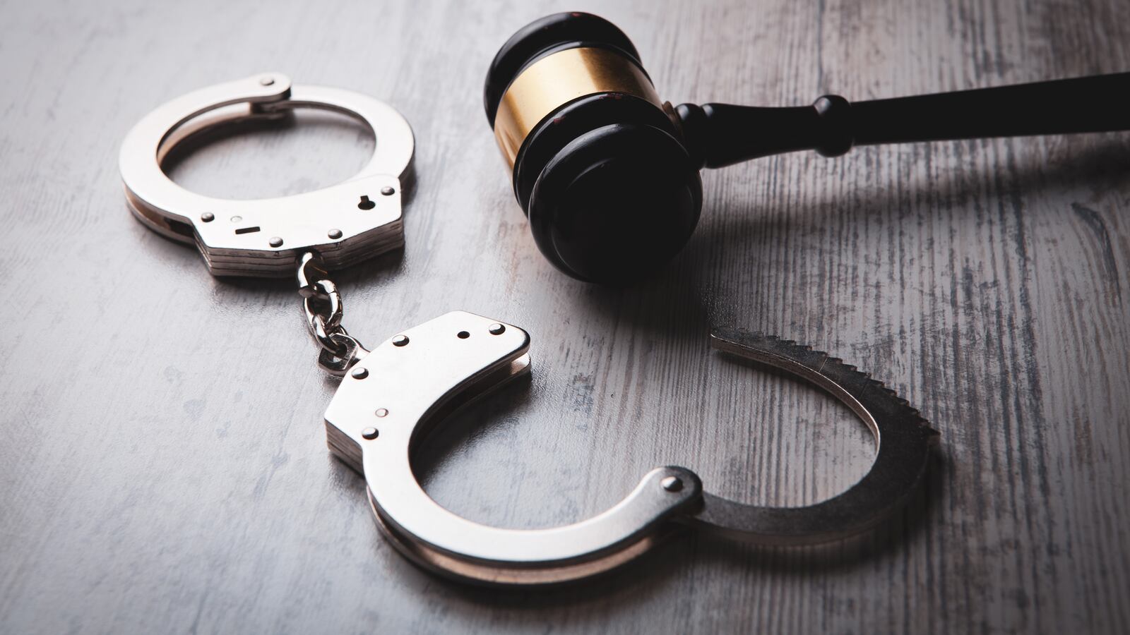 Gavel and handcuffs.