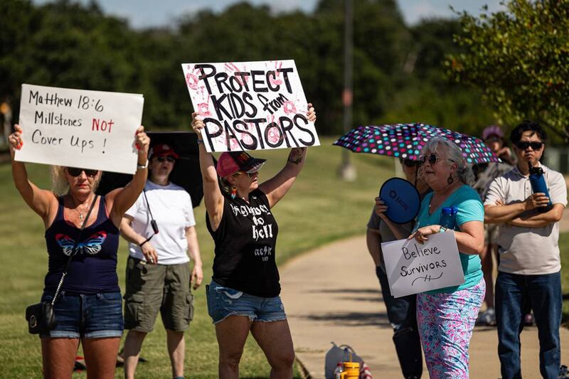 People gathered outside Texas' Gateway Church last year in protest of child sexual abuse following allegations against Morris, who founded the church in 2000.