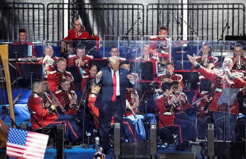 U.S. President Donald Trump gestures as the United States Marine Band performs at a rally to kick off the Great American State Fair in celebration of the 250th anniversary of U.S. independence on the National Mall in Washington, D.C., U.S., June 24, 2026.