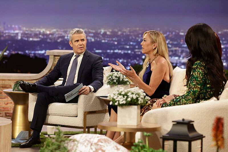 Photo still of Andy Cohen and Sutton Stracke.