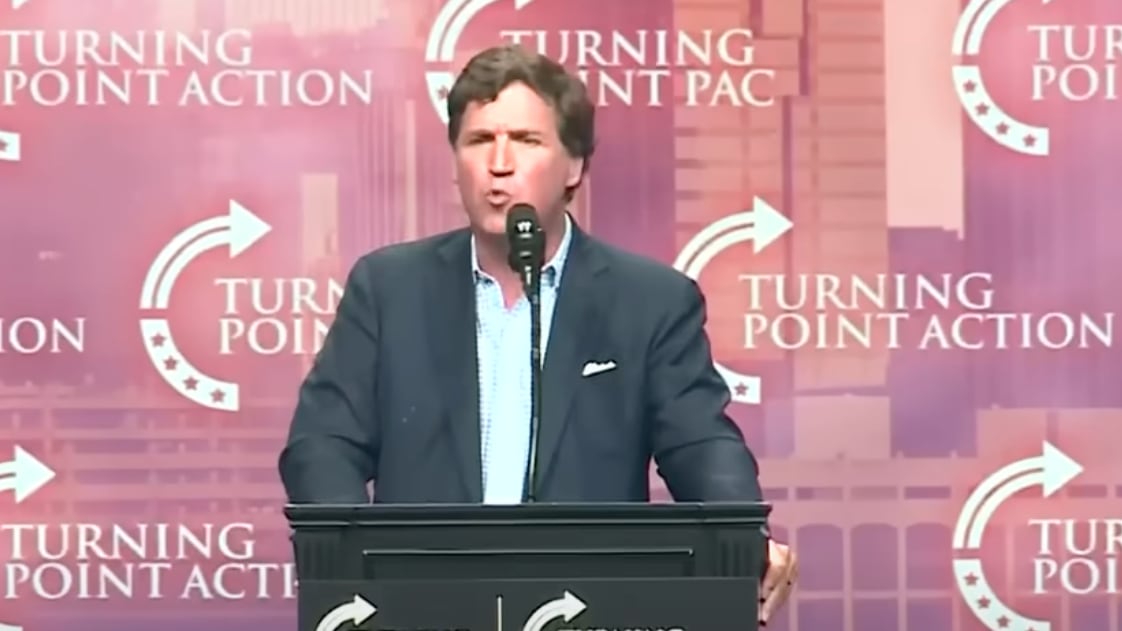 Tucker Carlson speaks at a rally for Donald Trump
