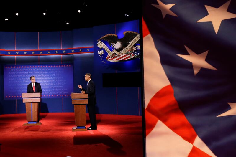articles/2012/10/04/mitt-romney-offense-trumped-barack-obama-defense-in-presidential-debate/debate-obama-speaks-with-flag_zyuixh