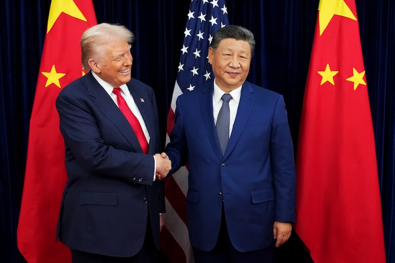 U.S. President Donald Trump greets Chinese President Xi Jinping ahead of a bilateral meeting at Gimhae Air Base on October 30, 2025 in Busan, South Korea.