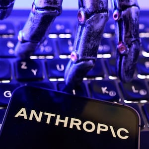 Anthropic logo, a keyboard and a robotic hand in this illustration taken June 5, 2026.