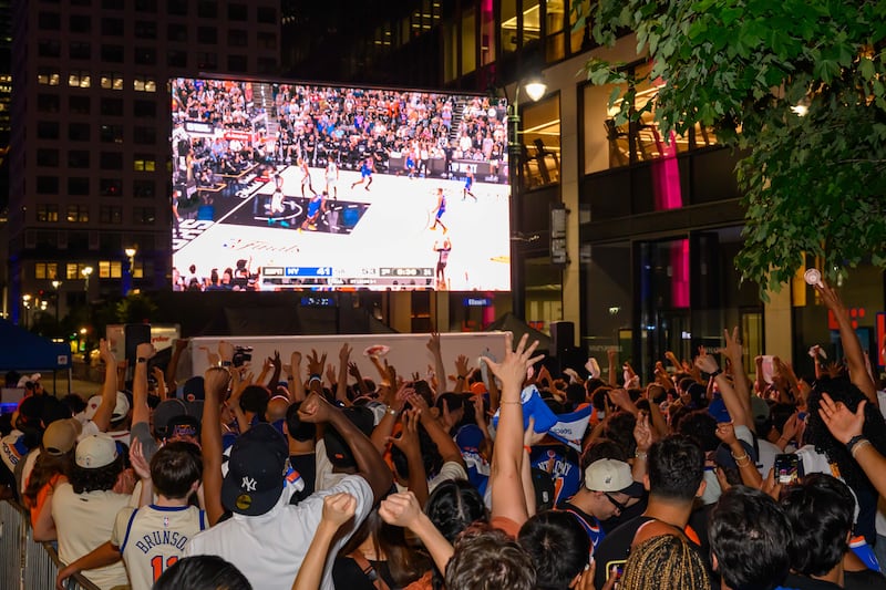 Jun 13, 2026; New York, New York, USA; New York Knicks fans cheer outside of Madison Square Garden on Plaza 33 while watching Game 5 of the NBA Finals between the New York Knicks and the San Antonio Spurs. Mandatory Credit: Brenden Willsch-Imagn Images