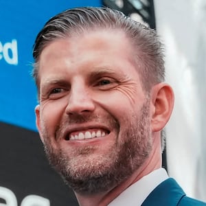 FILE PHOTO: Donald Trump Jr. and Eric Trump gesture outside the Nasdaq building after ringing the opening bell to celebrate the closing of ALT5’s $1.5 billion offering and adoption of its $WLFI Treasury Strategy at the Nasdaq Market, in New York City, U.S., August 13, 2025. The president’s sons are co-founders of World Liberty crypto group and have promoted WorldClaw on social media platform X.   REUTERS/Eduardo Munoz/File Photo