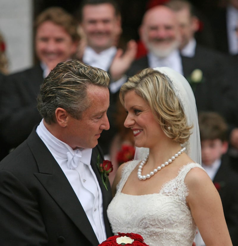 Riverdance star Michael Flatley and his wife, Niamh O'Brien, leave St Patrick's Church in Fermoy, Co. Cork, after their wedding today.