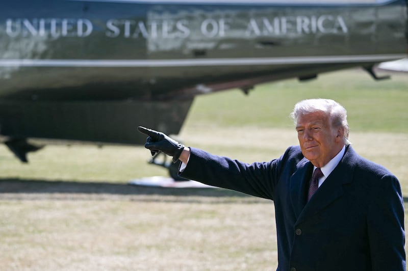 US President Donald Trump gestures as he walks to board Marine One as he departs the South Lawn of the White House for Texas in Washington, DC, on February 27, 2026. President Trump is traveling to Corpus Christi, Texas, to deliver remarks on energy. (Photo by ANDREW CABALLERO-REYNOLDS / AFP via Getty Images)