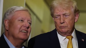 IN FLIGHT - JANUARY 04: U.S. President Donald Trump (R) and U.S. Sen. Lindsey Graham (R-SC) speak to the media aboard Air Force One enroute to Washington, DC on January 04, 2026. Trump is returning to the White House after giving the order for the United States law enforcement to capture Venezuelan President Nicolás Maduro and his wife. (Photo by Joe Raedle/Getty Images)