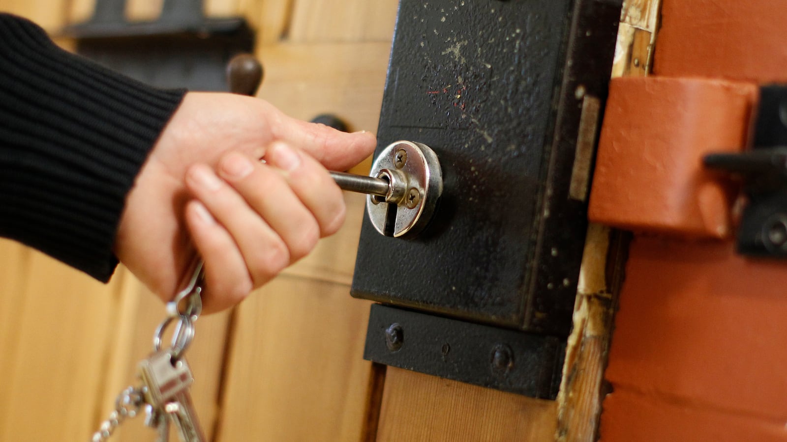 A prison officer locks the door of a cell for inmates serving long sentences in a newly renovated floor of the JVA Fuhlsbuettel prison in Hamburg, Jan. 13, 2011.