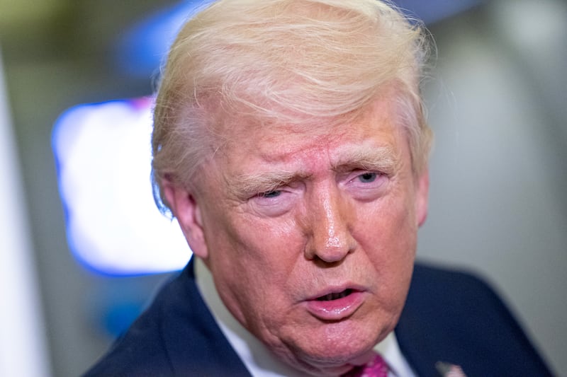 U.S. President Donald Trump speaks with members of the media onboard Air Force One on March 29, 2026 while en route to Joint Base Andrews, Maryland from West Palm Beach Florida.