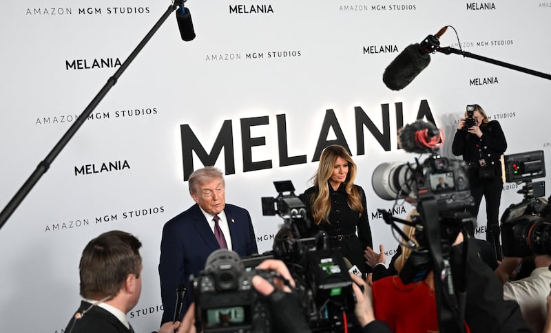 US President Donald Trump and US First Lady Melania Trump speak to journalists as they attend the world premiere of Amazon MGM Studios' "Melania"