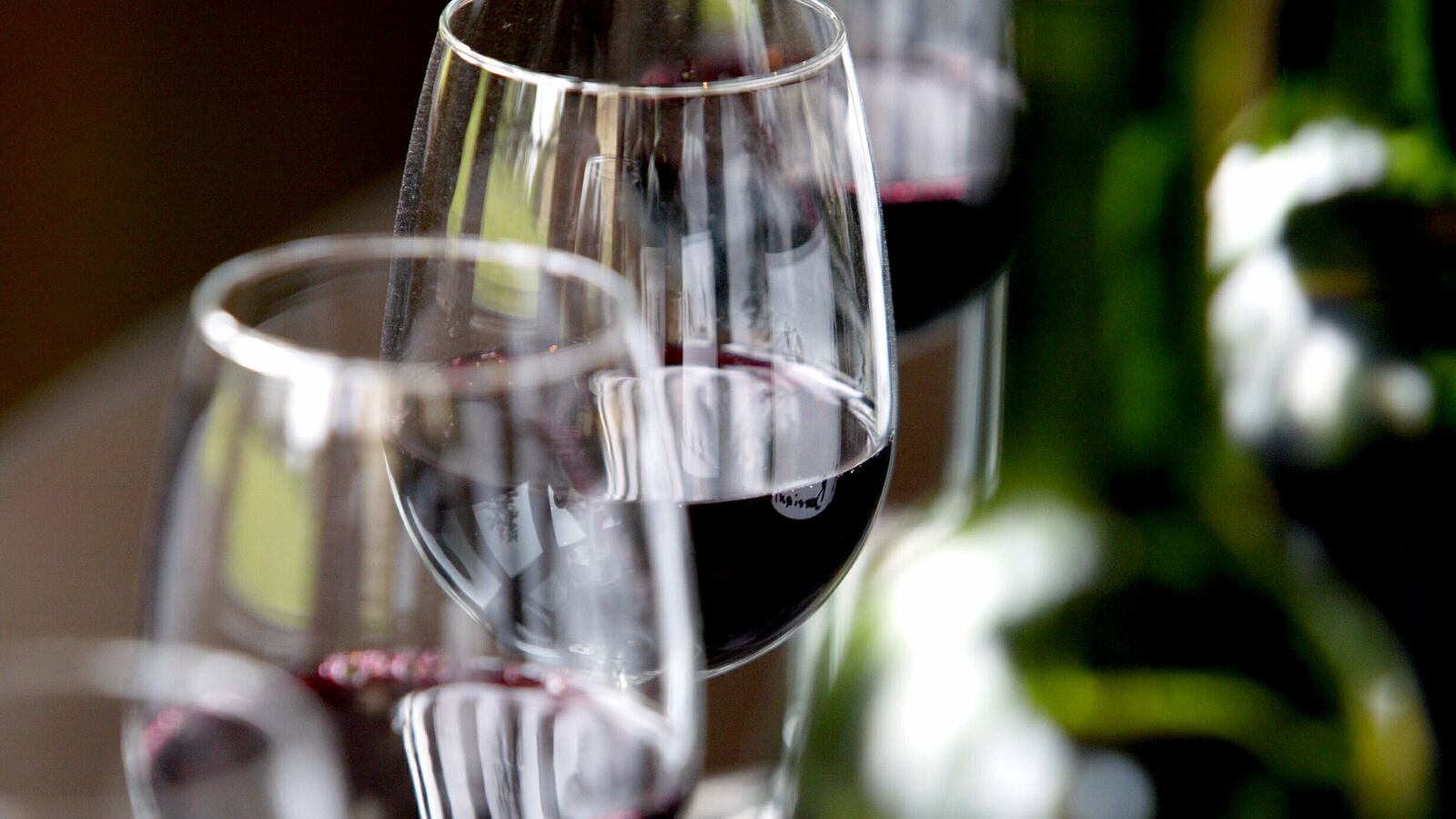 Glasses and bottles of Chateau Belcier red wine.