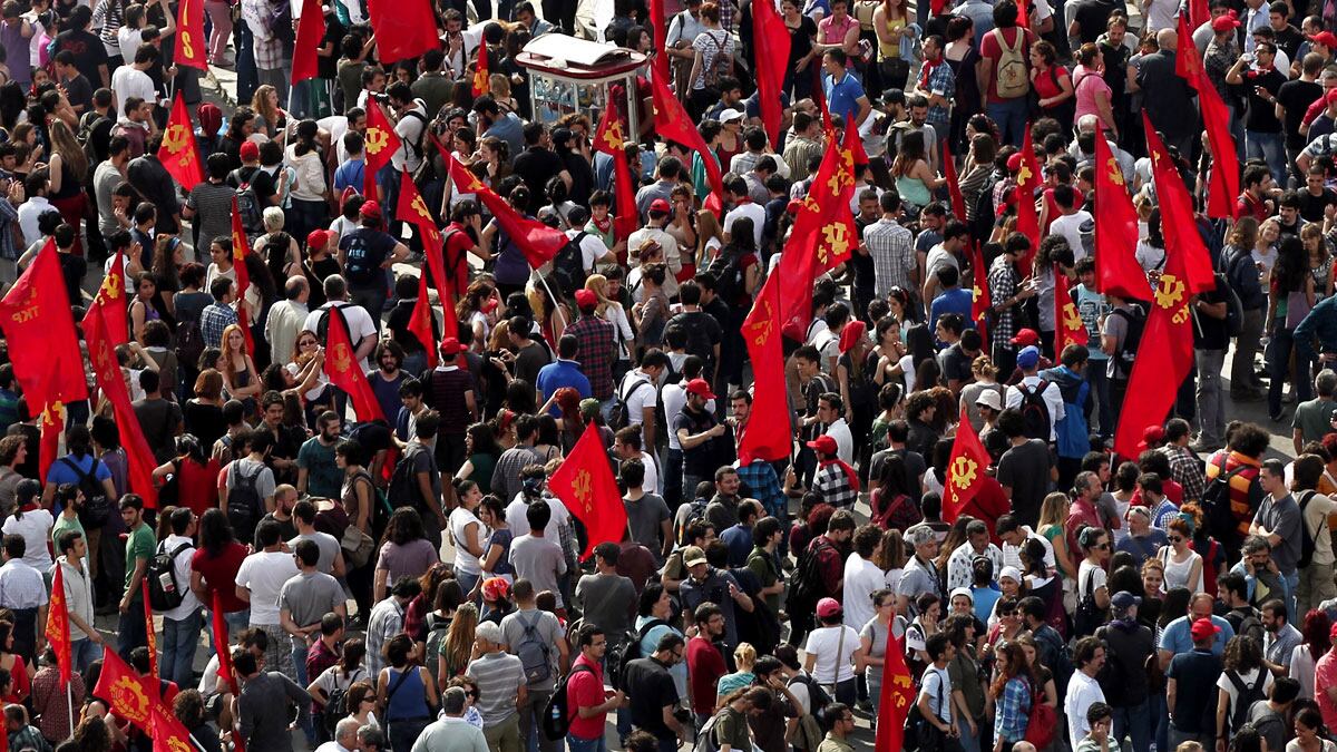 articles/2013/06/02/as-police-cede-taksim-square-istanbul-remains-on-edge/taksin-turkey-square-flags-tease_qalzt7