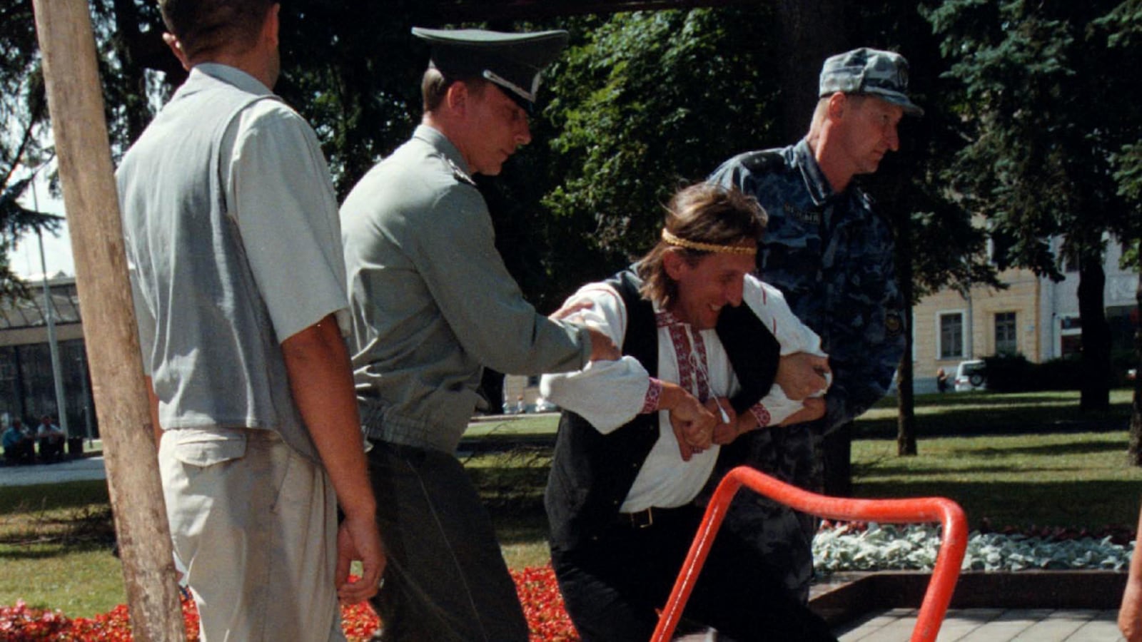 Militiamen attempt to remove Ales Pushkin, 33, after he brought a trolley of dung to the Administration of Belarussian President Alexander Lukashenko in Minsk July 21.