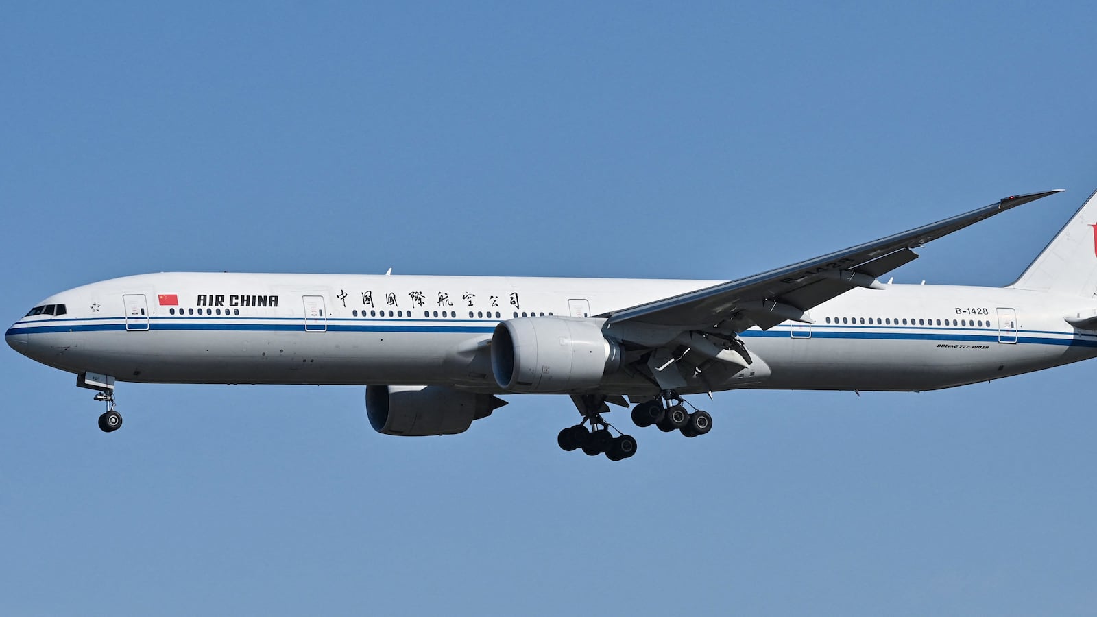 An Air China Boeing 777-300 ER plane prepares for landing at the Capital International airport in Beijing on October 22, 2024.