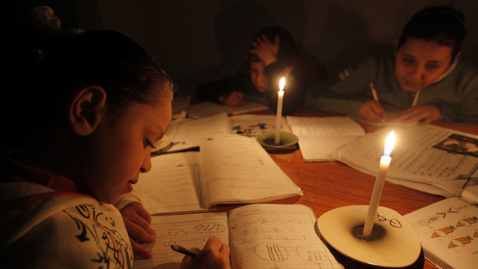 articles/2012/05/15/the-state-of-gaza/gazan-children-homework-openz_oxmou1