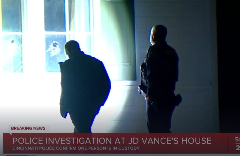 Officers check the damage to Vance's home.