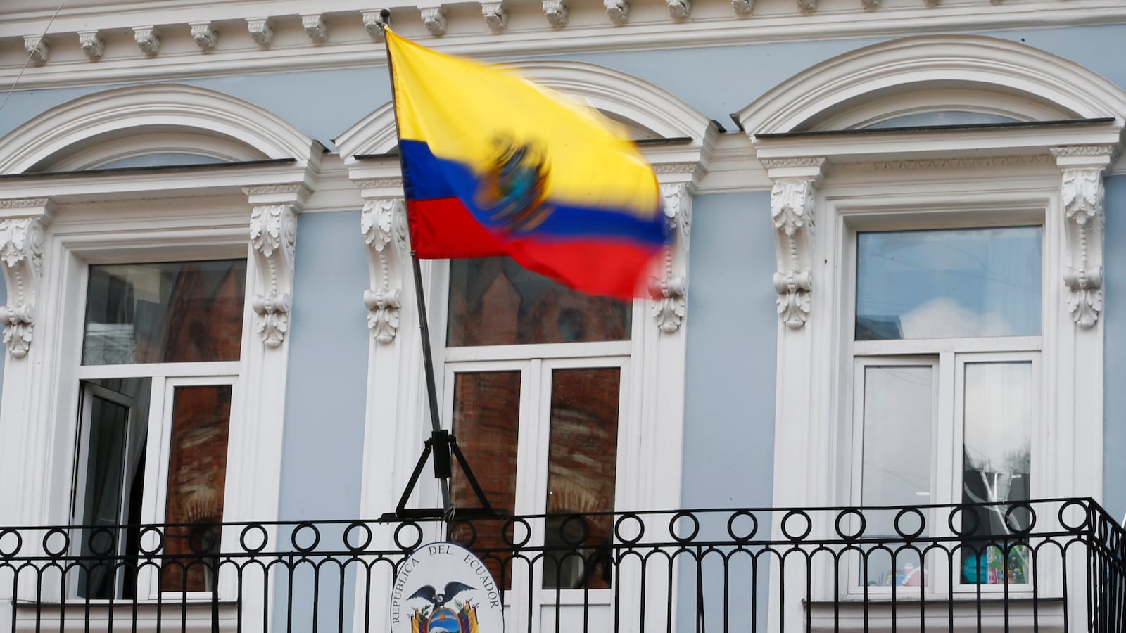 The national flag above the coat of arms is pictured at the embassy of Ecuador in Moscow, June 24, 2013.