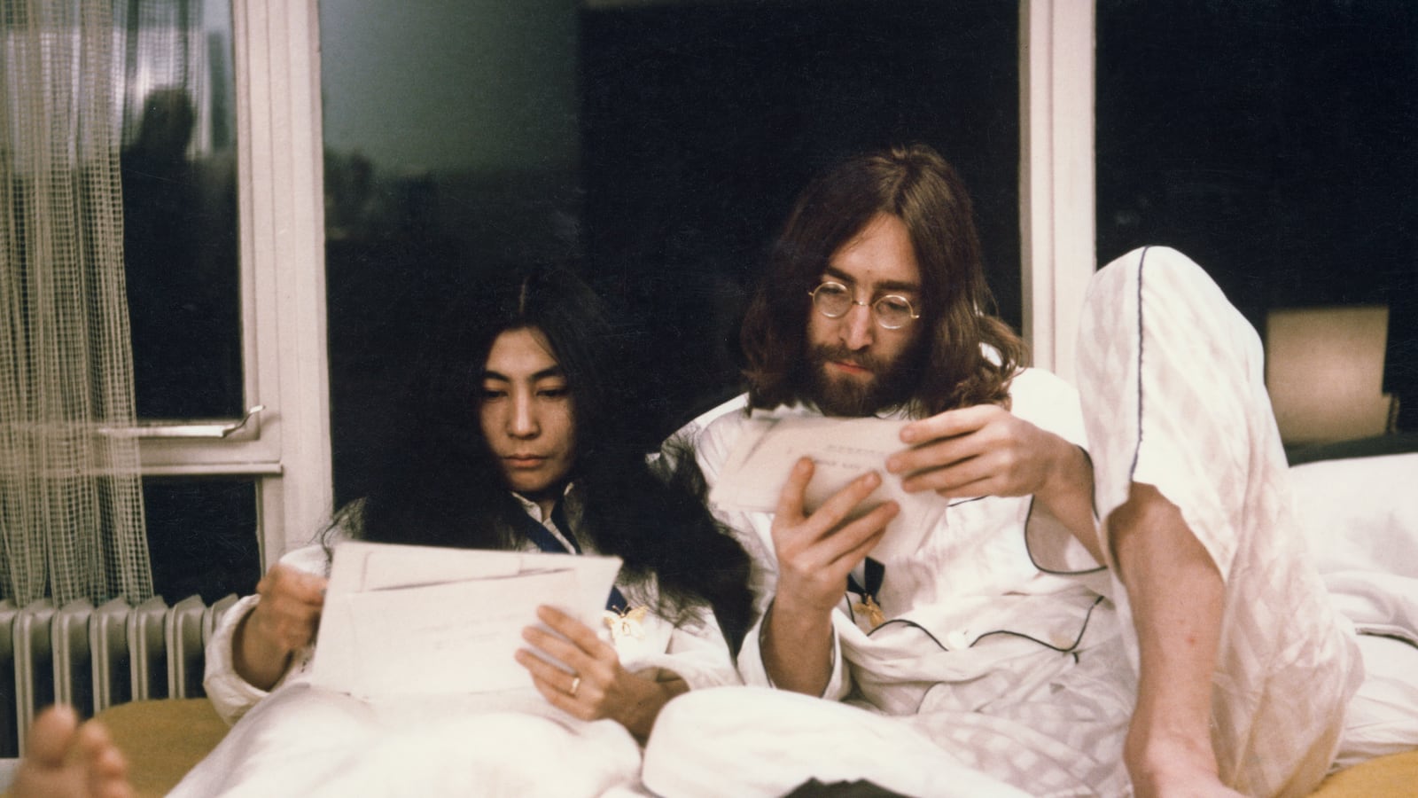 Yoko Ono and John Lennon sit up in bed at the Hilton hotel in Amsterdam, Netherlands in March 1969.