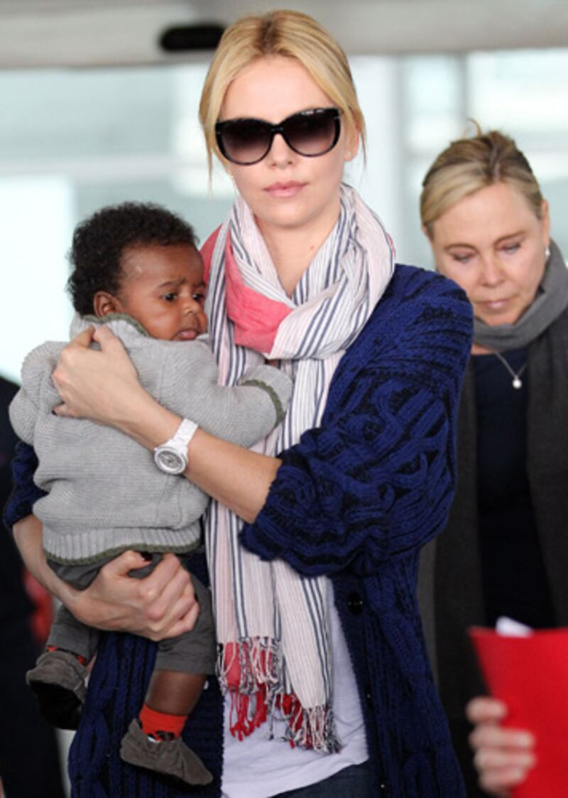 galleries/2012/05/11/beyonce-jessica-simpson-more-first-time-celeb-moms-photos/charlize-theron-celeb-first-time-mothers_gqozwz