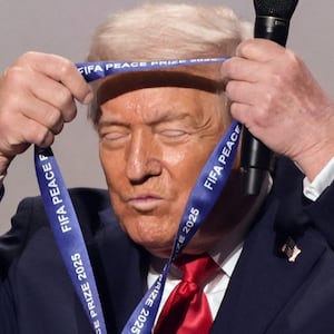 U.S. President Donald Trump places the medal on himself